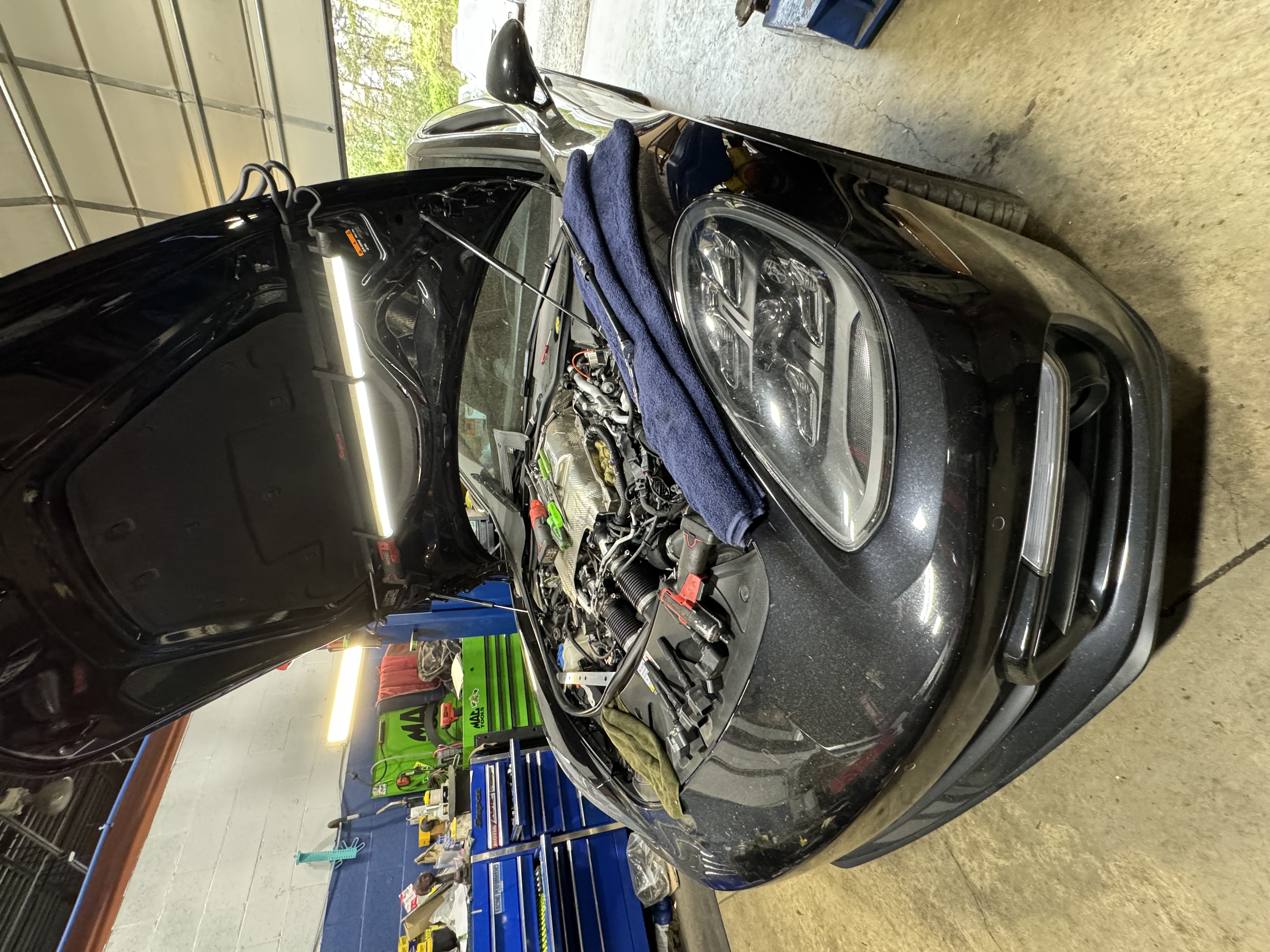 Mechanic working on a vehicle in the shop