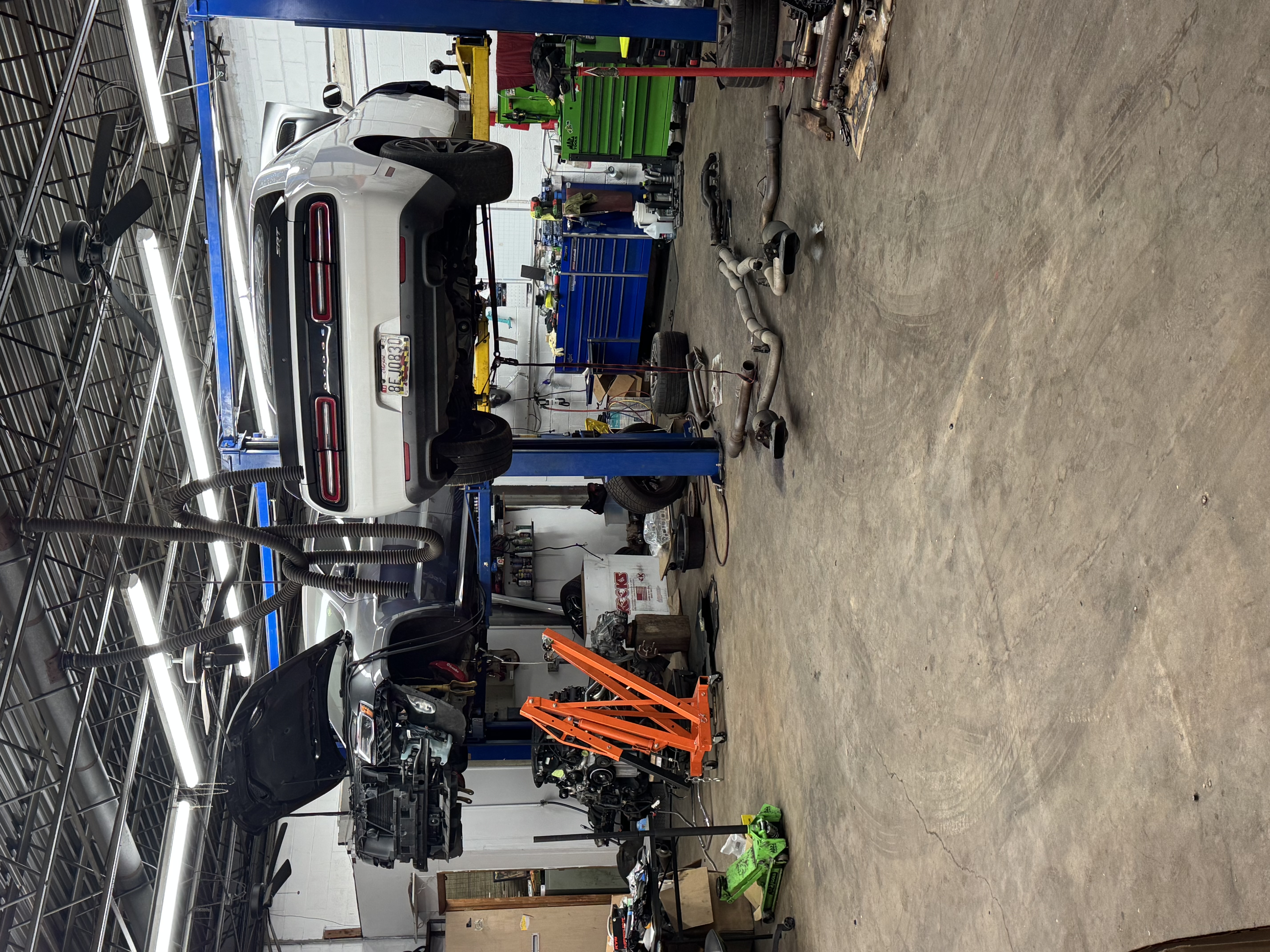 Auto shop service bay with vehicles